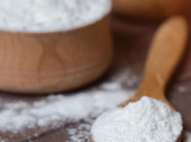potato-starch-with-potatoes-dark-wooden-background_194017-1321